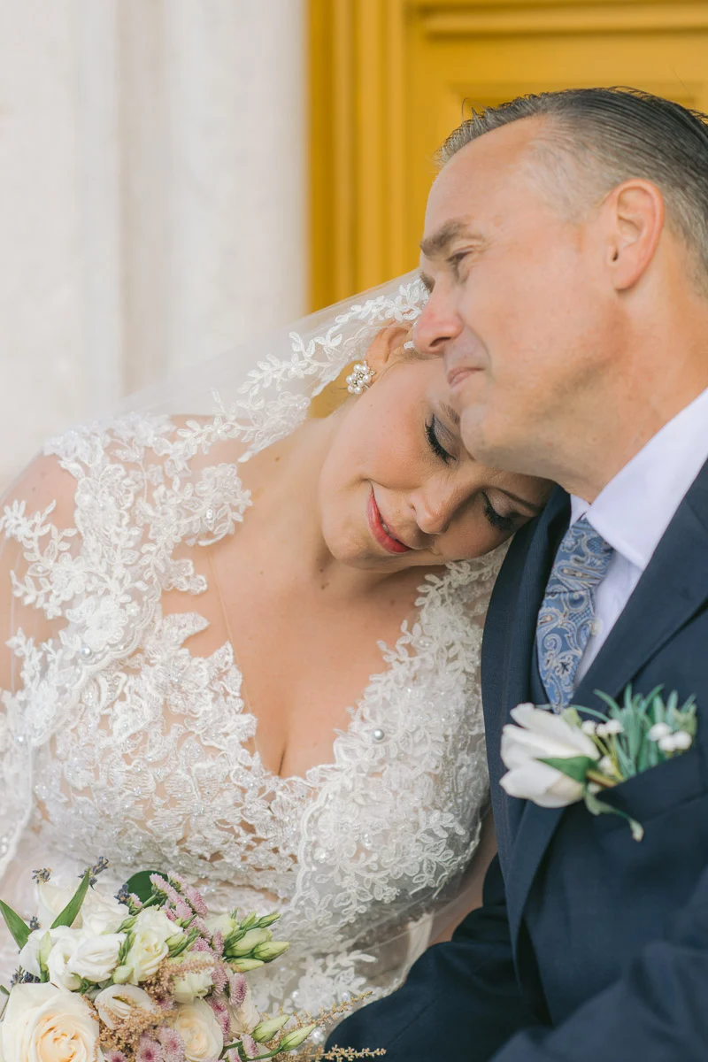 Jennifer resting her head on Ethan's shoulder, wedding portrait at Biester Palace, Sintra