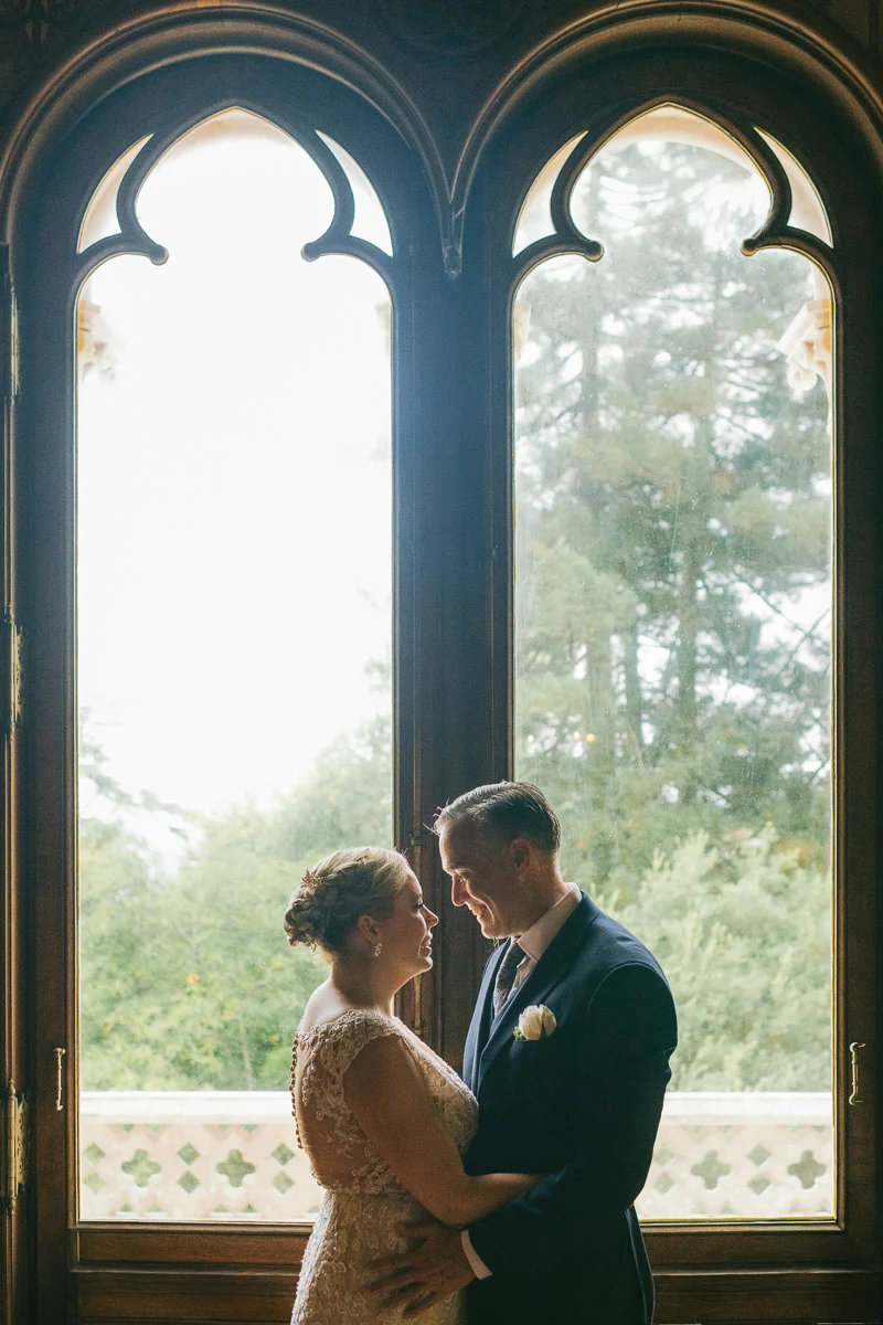 Ethan and Jennifer in front of the Gothic arched window inside Biester Palace, Sintra